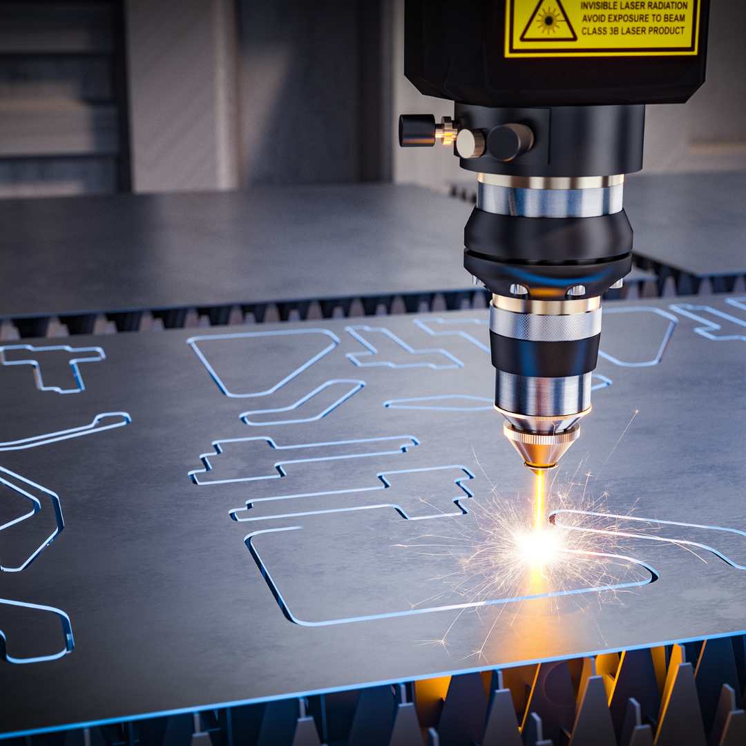 CNC laser cutting through metal.